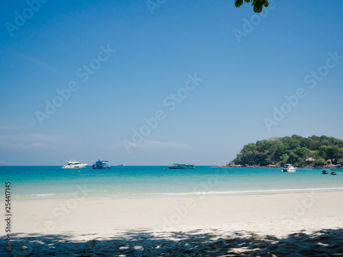 Thailand beach with boats on the sea