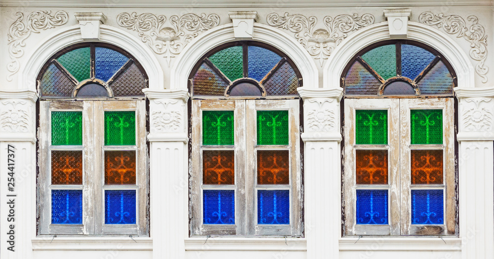 Colorful windows at the old Sino-Portuguese architectural building in Phuket, Thailand