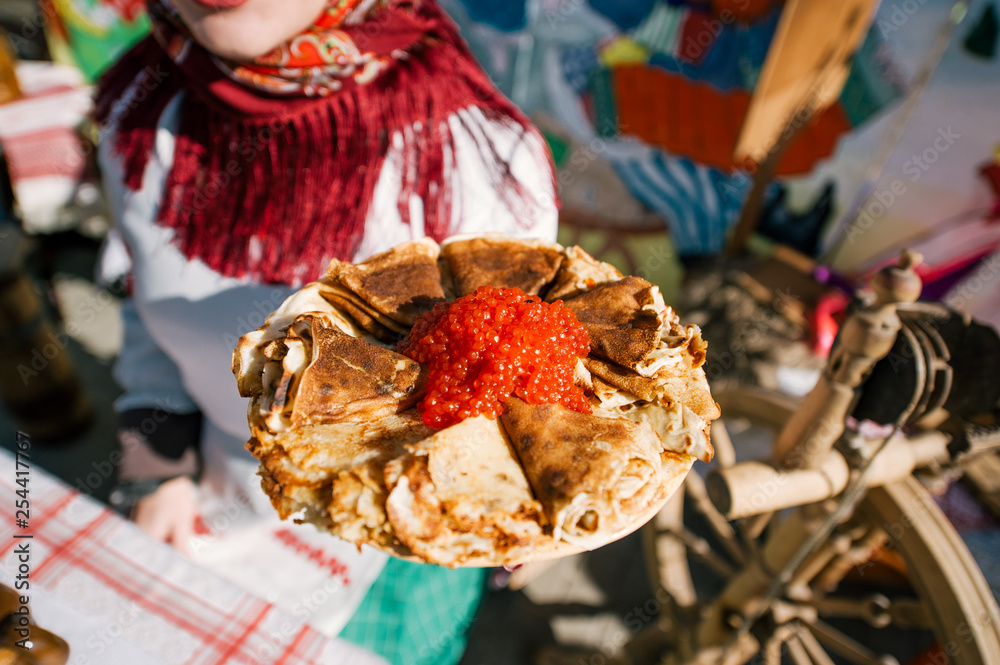 Stack of russian pancakes with red caviar. The concept of Russian holiday Maslenitsa, Shrovetide.
