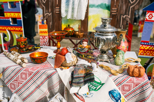 Traditional Russian Tea Party including hot black tea from samovar. Decoration on wooden table