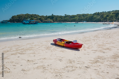 Red canoe on a beach