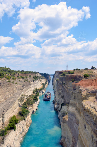 Corinth Canal in a bright sunny day against a blue sky.