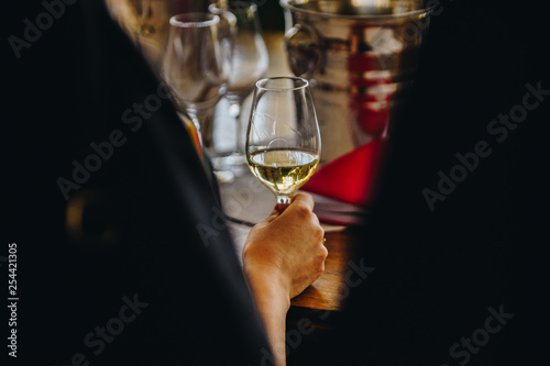 A Glass of White Wine at a Table Tasting