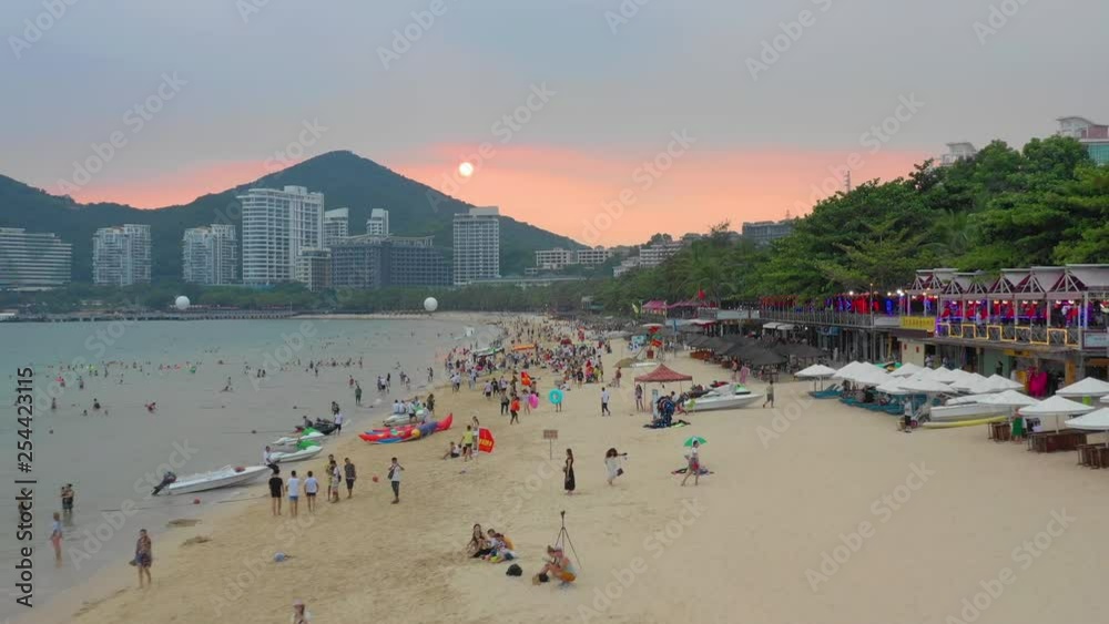 sunset time sanya famous dadonghai crowded beach aerial panorama 4k hainan china sunset time sanya famous dadonghai crowded beach aerial panorama 4k hainan china