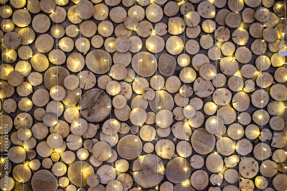 Wall texture from wood slab and Christmas garlands Wall texture from wood slab and Christmas garlands