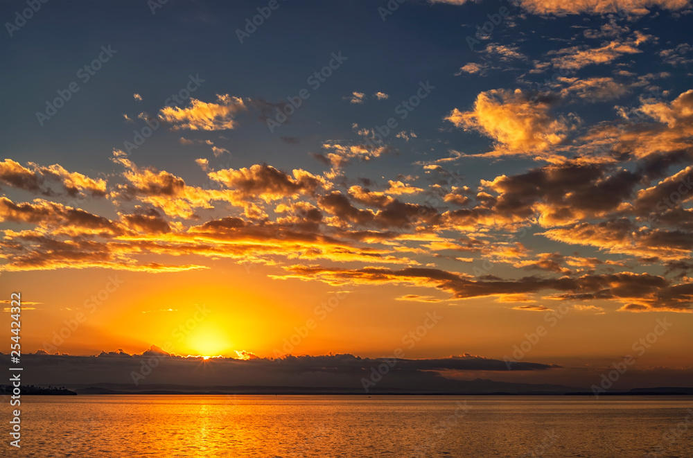 Beautiful ocean landscape with vibrant sunset or sunrise