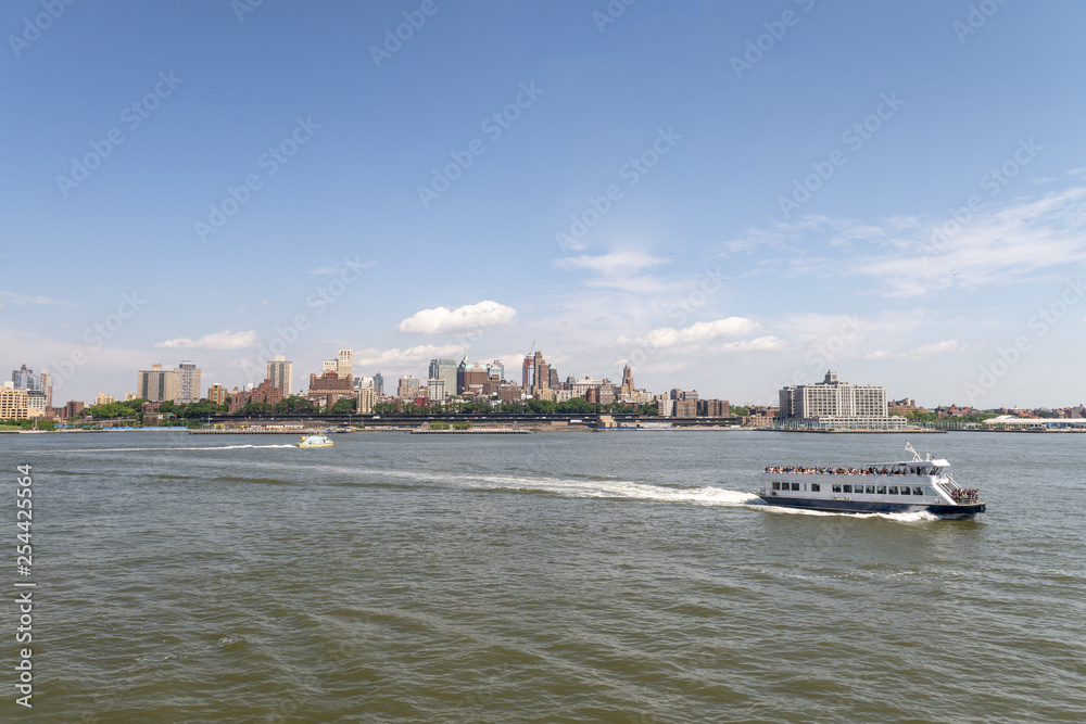 Ferry traveling on the city river