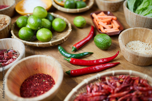 Closeup background of various spices in wooden bowls on table, copy space