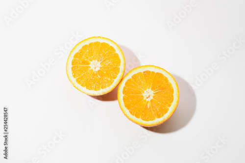 Orange halves on white background