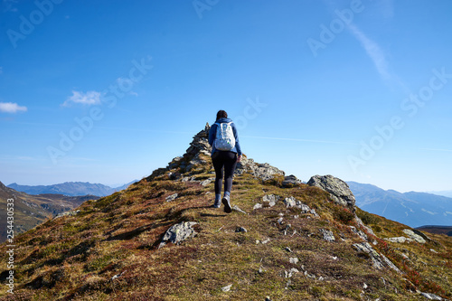 Woman hiking on Mountain "Schwendberg" in austrias alps / Nice paths, peaks and lakes in Zillertal