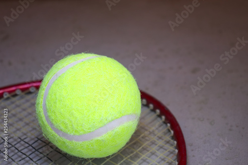 Tennis ball on racket. © Adrian