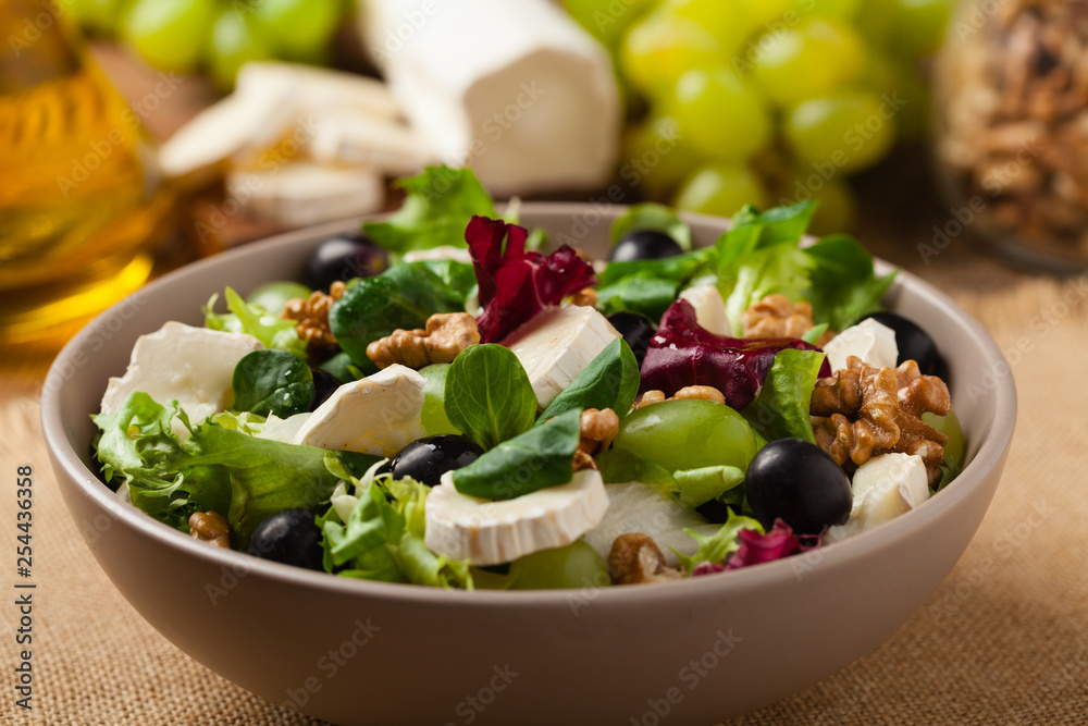 Italian spring salad with goat cheese, grapes and walnuts. Served with croutons. Italian spring salad with goat cheese, grapes and walnuts. Served with croutons.