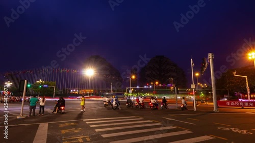 night time illuminated sanya traffic street crossroad famous hotel panorama 4k timelapse hainan island china photo