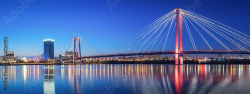 panorama night city of Krasnoyarsk bridge in lights