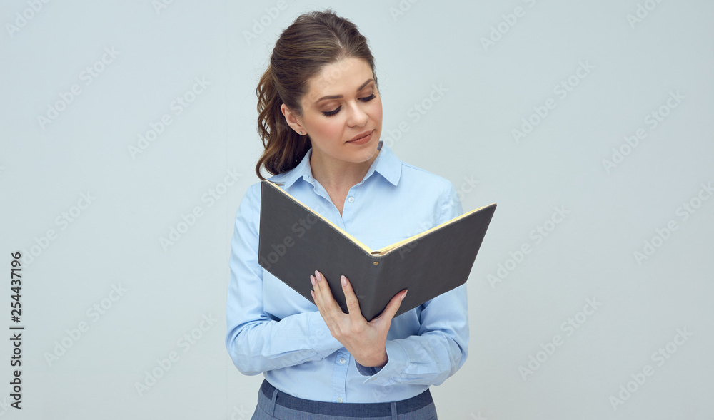 Business woman, student holding openbook and reading. Business woman, student holding openbook and reading.