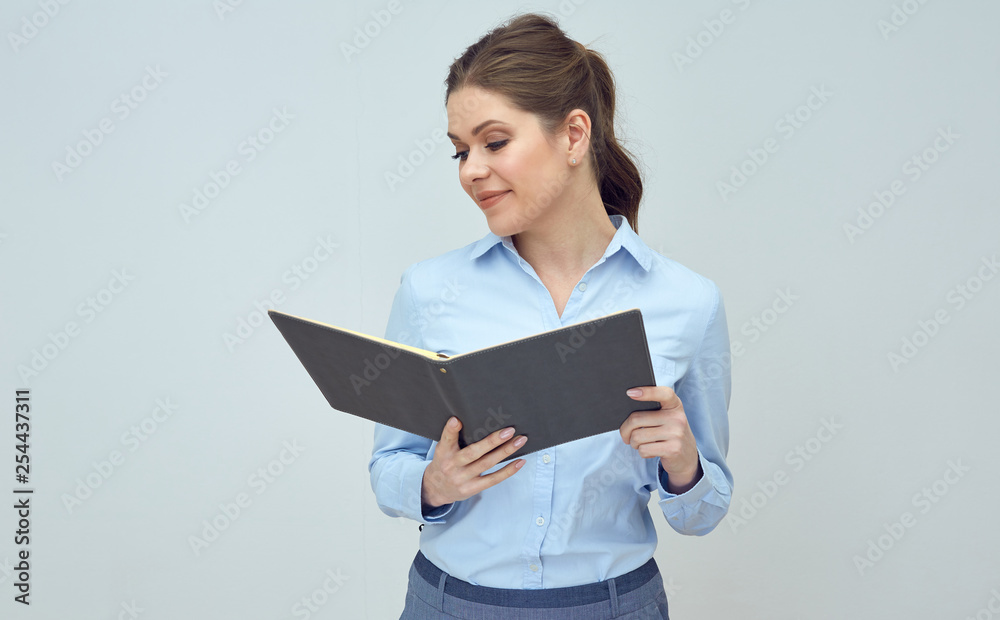 Business woman, student holding openbook and reading. Business woman, student holding openbook and reading.