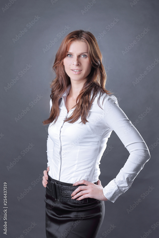 portrait of modern business woman on dark background.