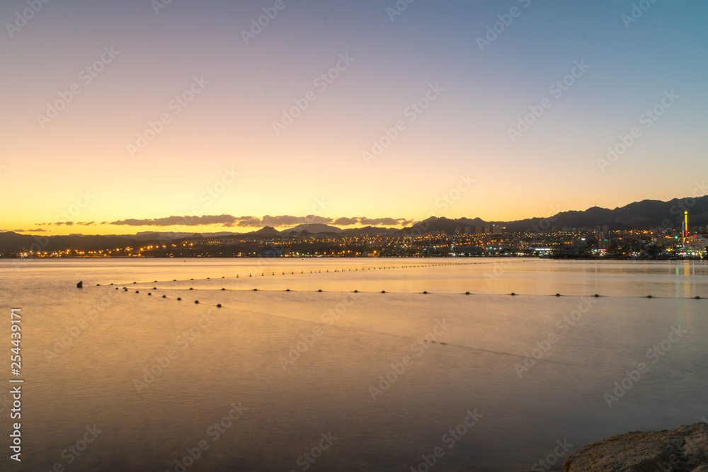 Beautiful orange sunset over Eilat city.