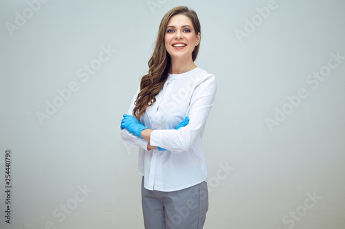 Photography woman doctor in medical uniform standing with crossed ams wearing blue glow