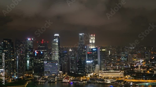 Wallpaper Mural Panning night time lapse shot with the focus on the cityskape of Singapore city and its skyscrapers. Torontodigital.ca