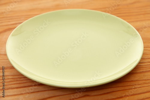empty green dish on the wooden table