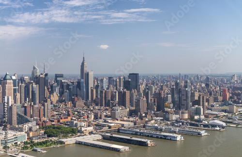 Amazing aerial view of New York City. Midtown Manhattan skyline from helicopter on a sunny afternoon © jovannig