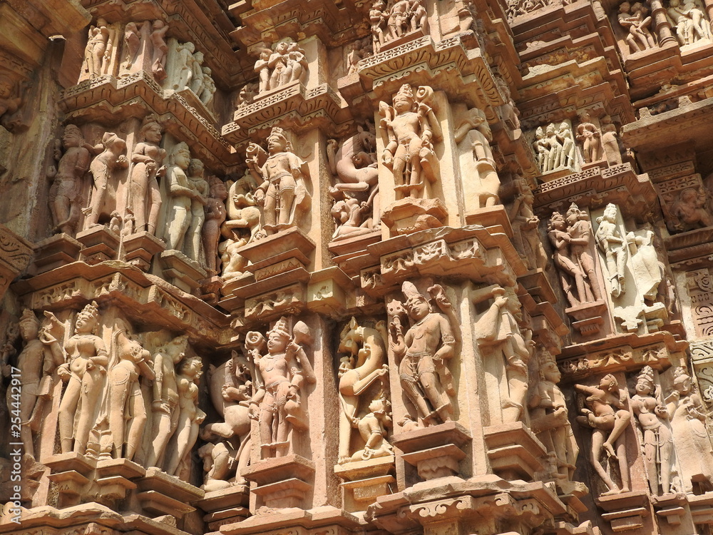 The Western group of Khajuraho temples, a UNESCO heritage site, is famous for its erotic sculptures, India, clear day.