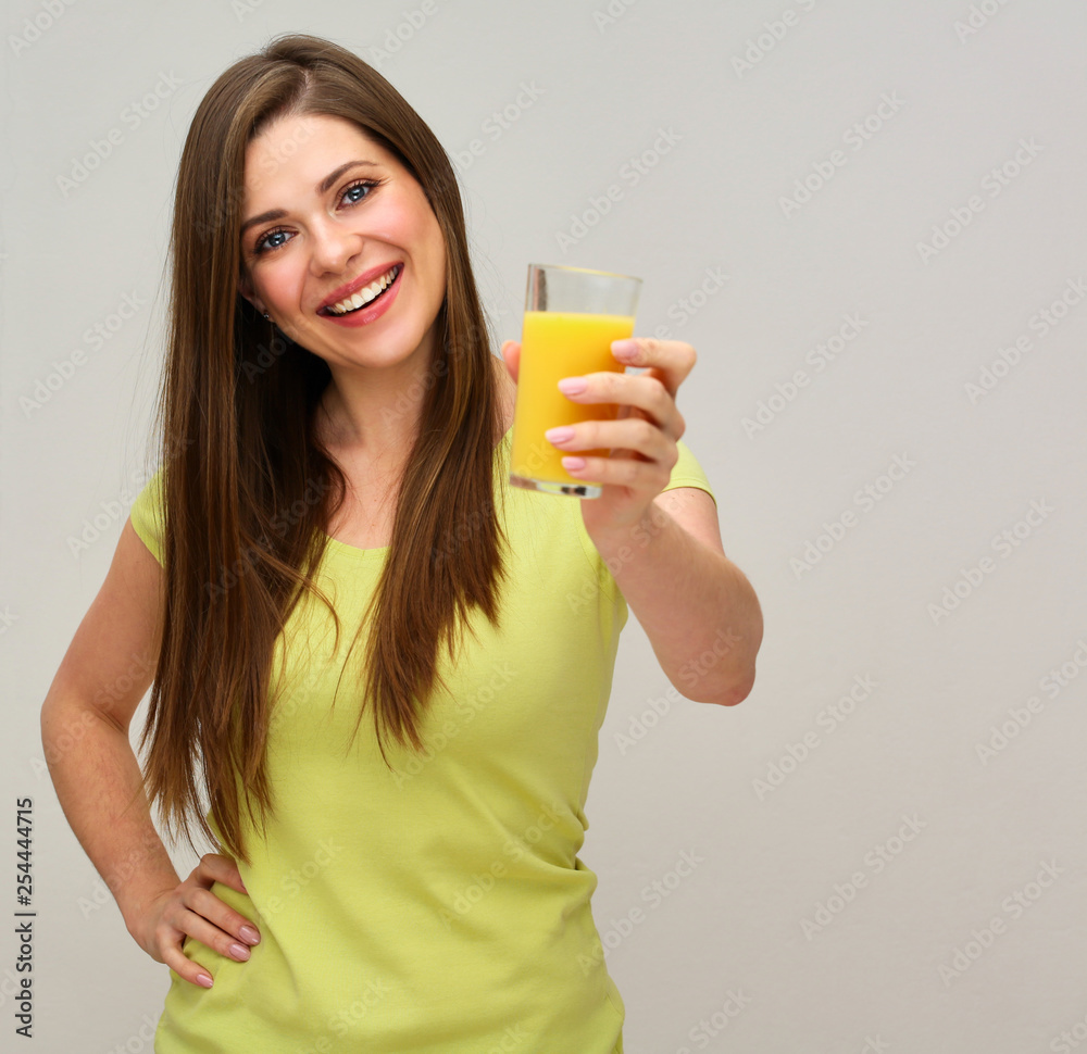 smiling woman holding orange juice glass. smiling woman holding orange juice glass.