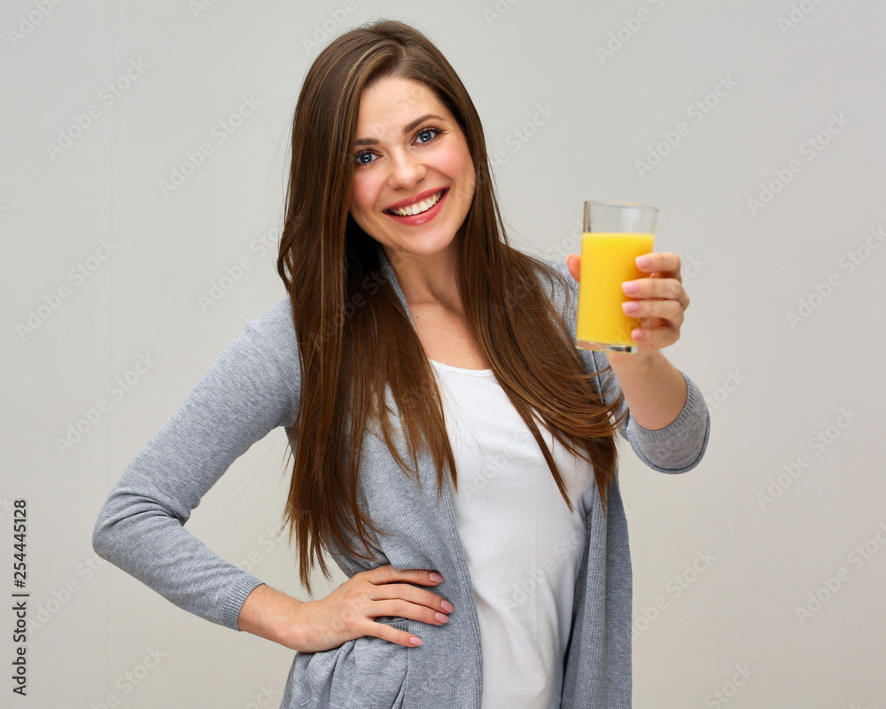 smiling woman holding orange juice drink. smiling woman holding orange juice drink.