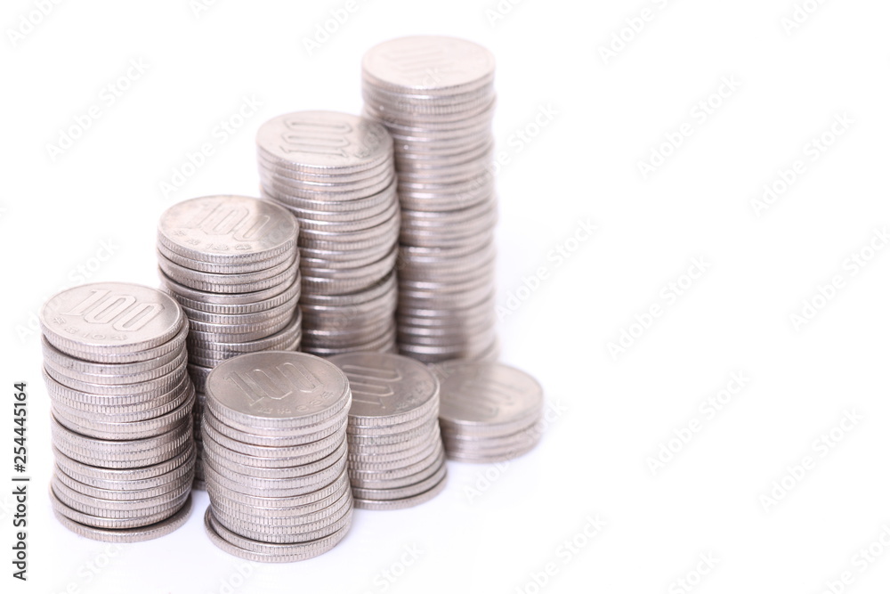 stacked Japanese 100 yen coins step up and step down graph stacked Japanese 100 yen coins step up and step down graph