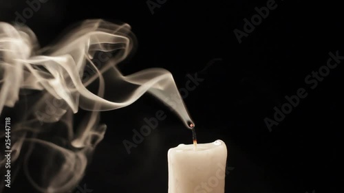 Candle blow out with smoke isolated on black background