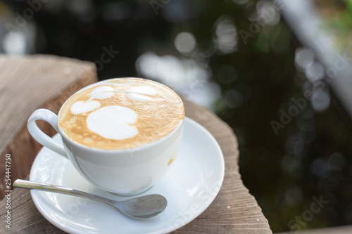 Cup of coffee on old wooden background
