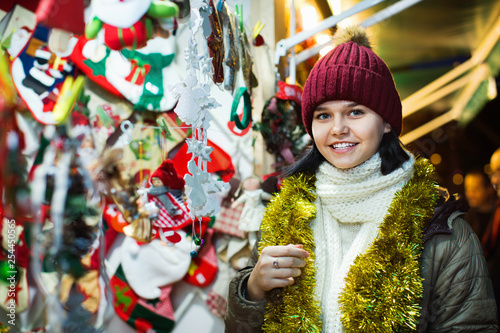 Teenage girl shopping at festive fair before Xmas