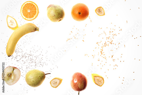 Fototapeta Naklejka Na Ścianę i Meble -  Pomarańcza, gruszka jabłko, banan nasiona chia i siemię lniane na białym tle