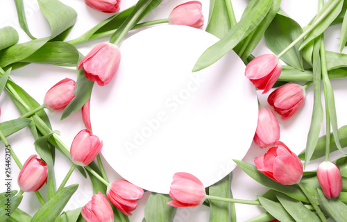 Floral background with tulips flowers on white background. Flat lay, top view. Lovely greeting card with tulips for Mothers day, wedding or happy event - Image.