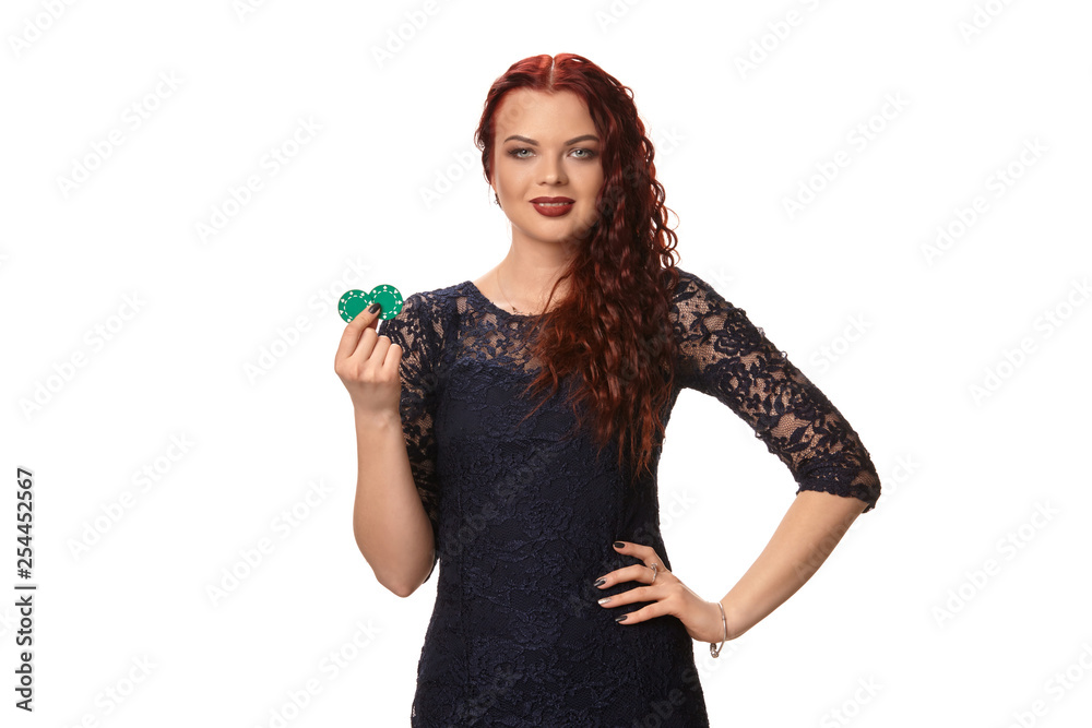 Sexy redheaded woman with a curly hair is posing with some blue chips in her hands. Poker Sexy redheaded woman with a curly hair is posing with some blue chips in her hands. Poker
