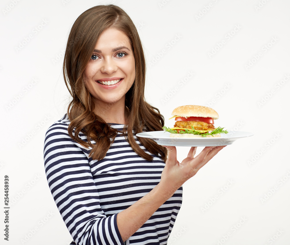smiling woman holding plate with cheese burger. smiling woman holding plate with cheese burger.