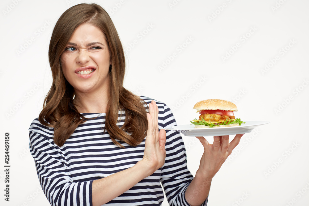 Woman diet concept with girl rejected burger. Woman diet concept with girl rejected burger.