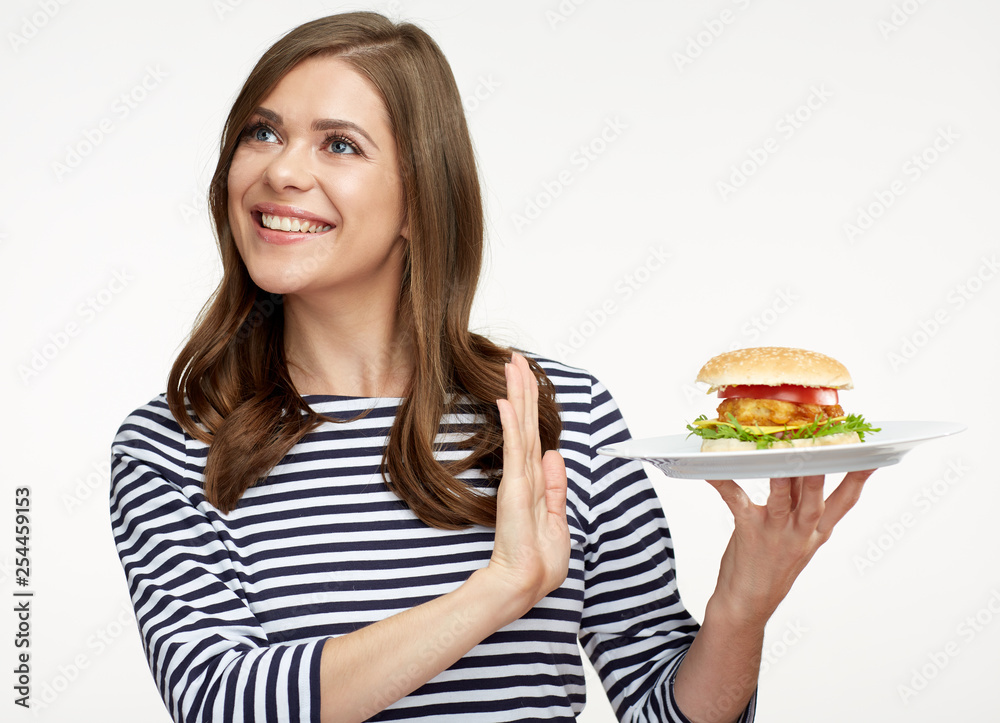 Woman diet concept with girl rejected burger.