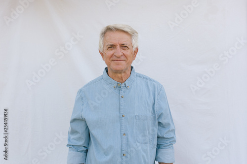 Senior man on white background