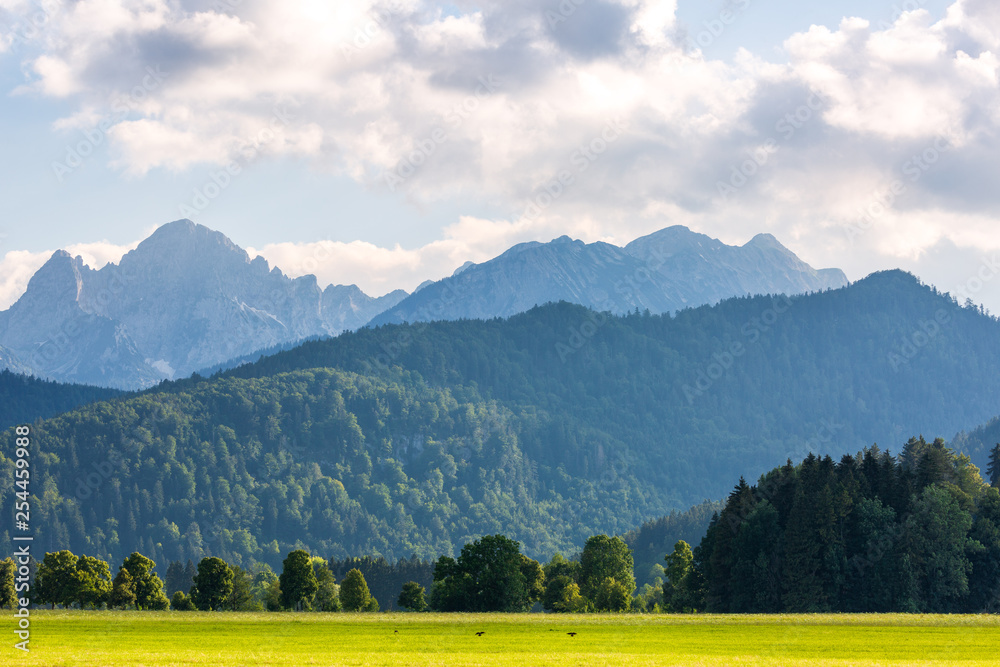 Beautiful lanscape with the field on foreground and mountains on background, Germany