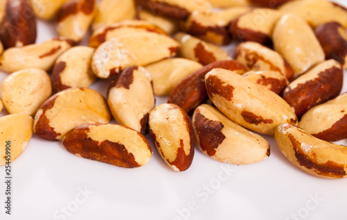 Roasted Brazil nuts on white surface