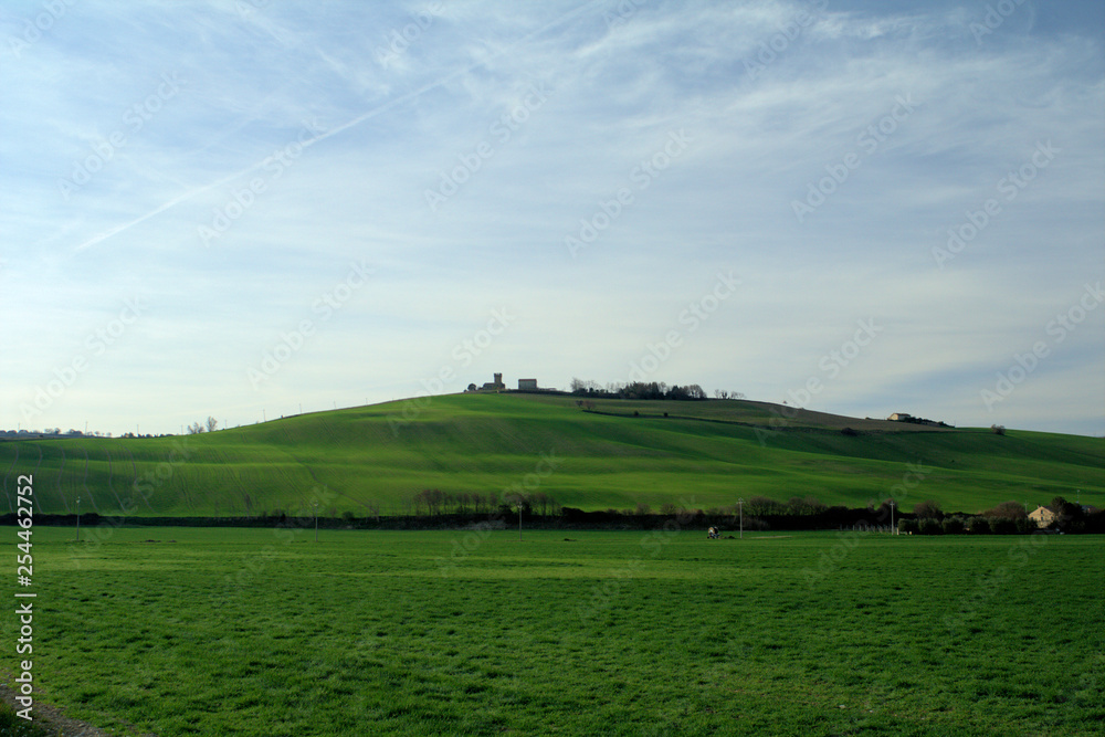 landscape with green field,hill,horizon,agriculture,spring,rural,cloud,countryside,view