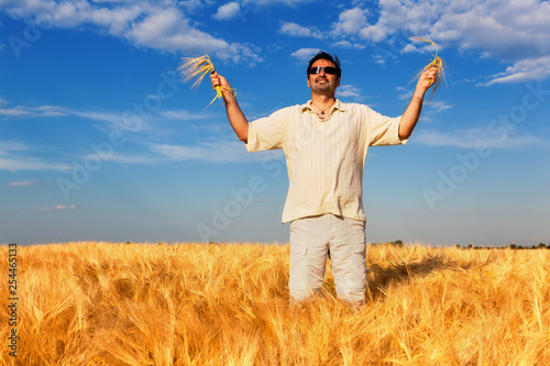 man in wheat field © Avatar_023