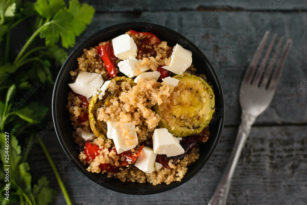 Baked vegetable salad with quinoa and Serbian cheese. Vegetarian dish. The view from the top. Flat lay. Baked vegetable salad with quinoa and Serbian cheese. Vegetarian dish. The view from the top. Flat lay.