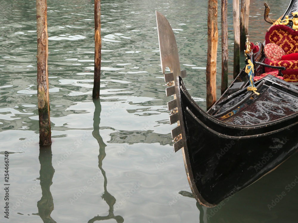 typical Venetian boat called GONDOLA in the waterway