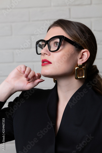 Woman in business clothes and glasses