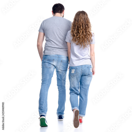 Woman and man on move walking on white background isolation, rear view