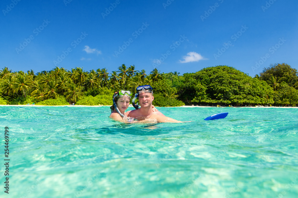 Young Couple enjoying in the turquoise water