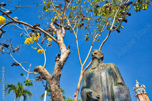 Puerto Vallarta, Mexico-20 April, 2018: Ignacio Vallarta monument in front of Our Lady of Guadalupe church in historic city center photo